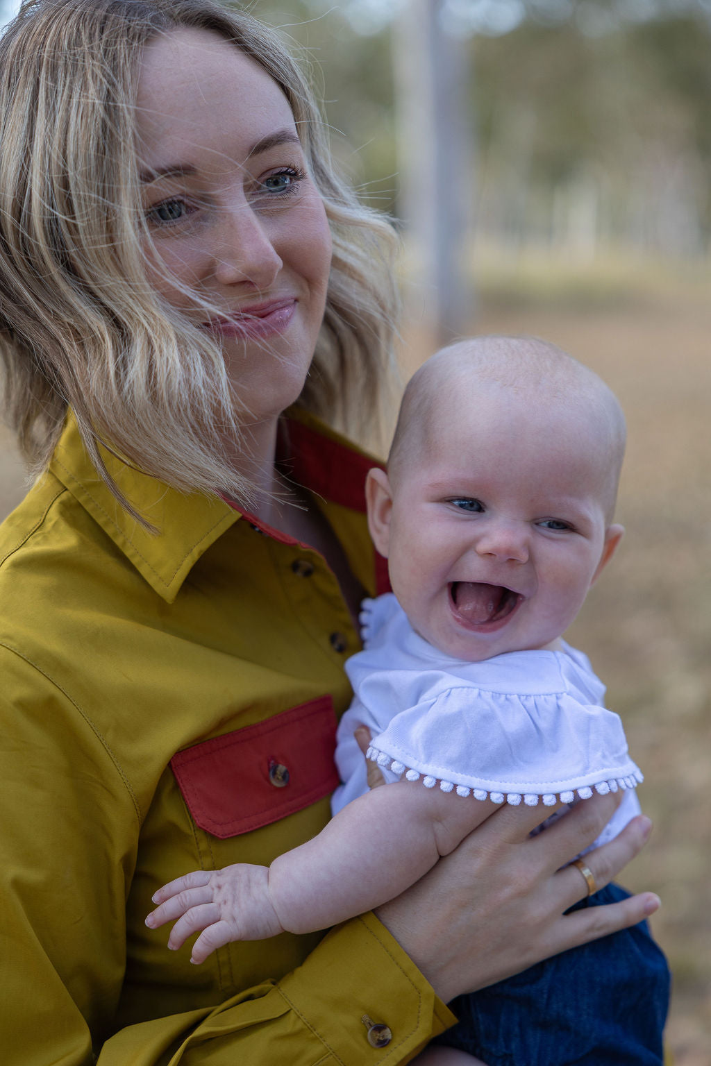 Mum holding baby wearing Half Button Long Sleeve Breastfeeding Shirt | The Sundown TittyTees Breastfeeding Apparel