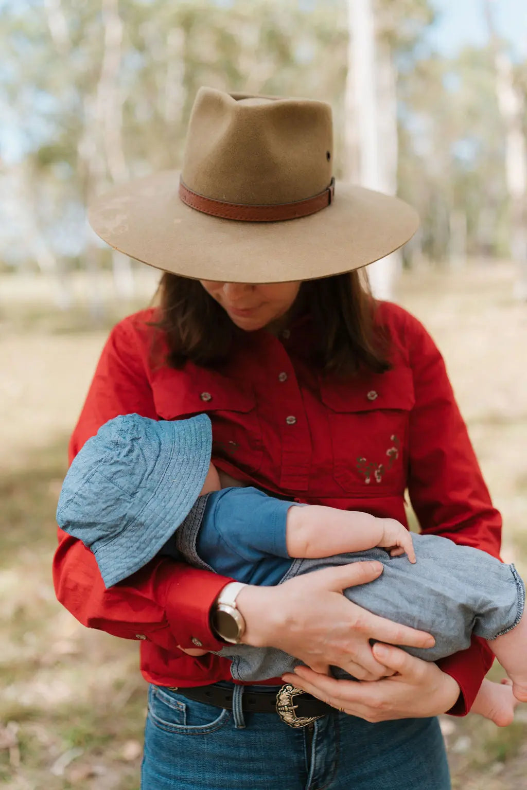 Mum nursing baby in a breastfeeding shirt