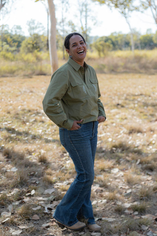 Mum standing outdoors showing breastfeeding shirt