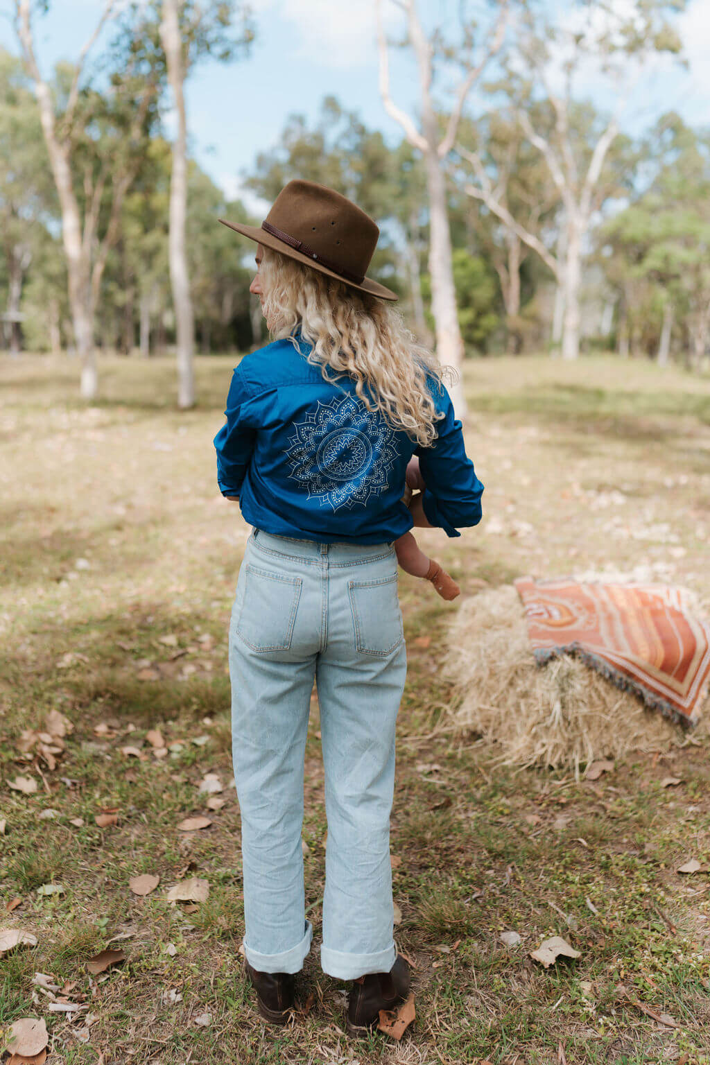 Showing mandala print on back of breastfeeding work shirt
