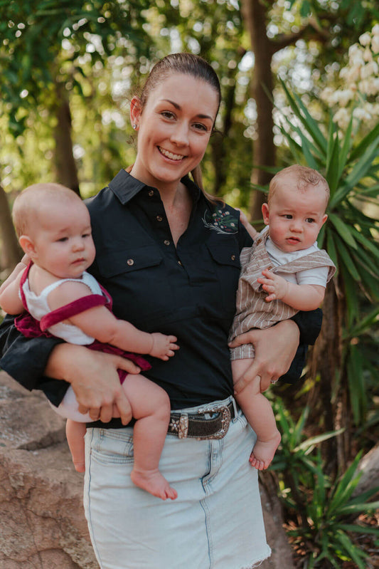 Mum holding twins wearing TittyTees long sleeve breastfeeding shirt