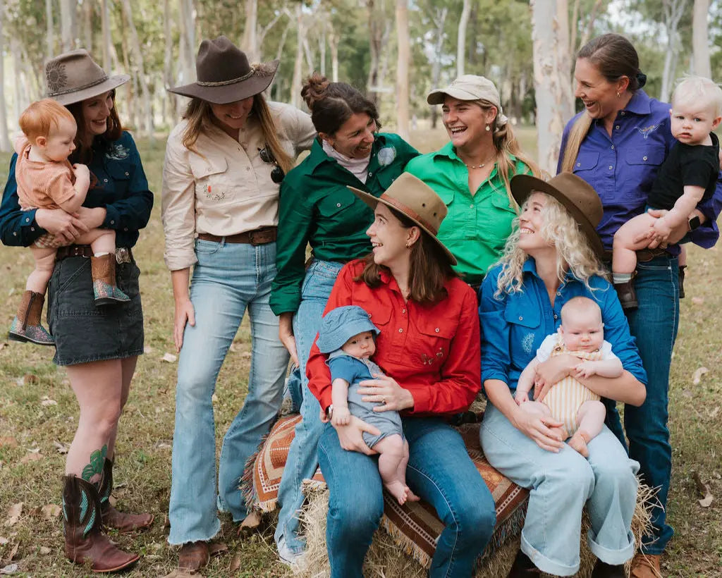 Group of mums wearing TittyTees breastfeeding shirts.