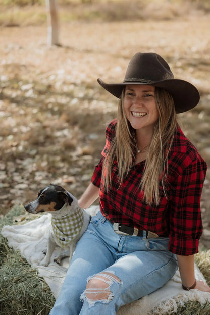 Outdoors sitting on hay bale with jack Russel dog wearing Long sleeve breastfeeding Fannette shirt