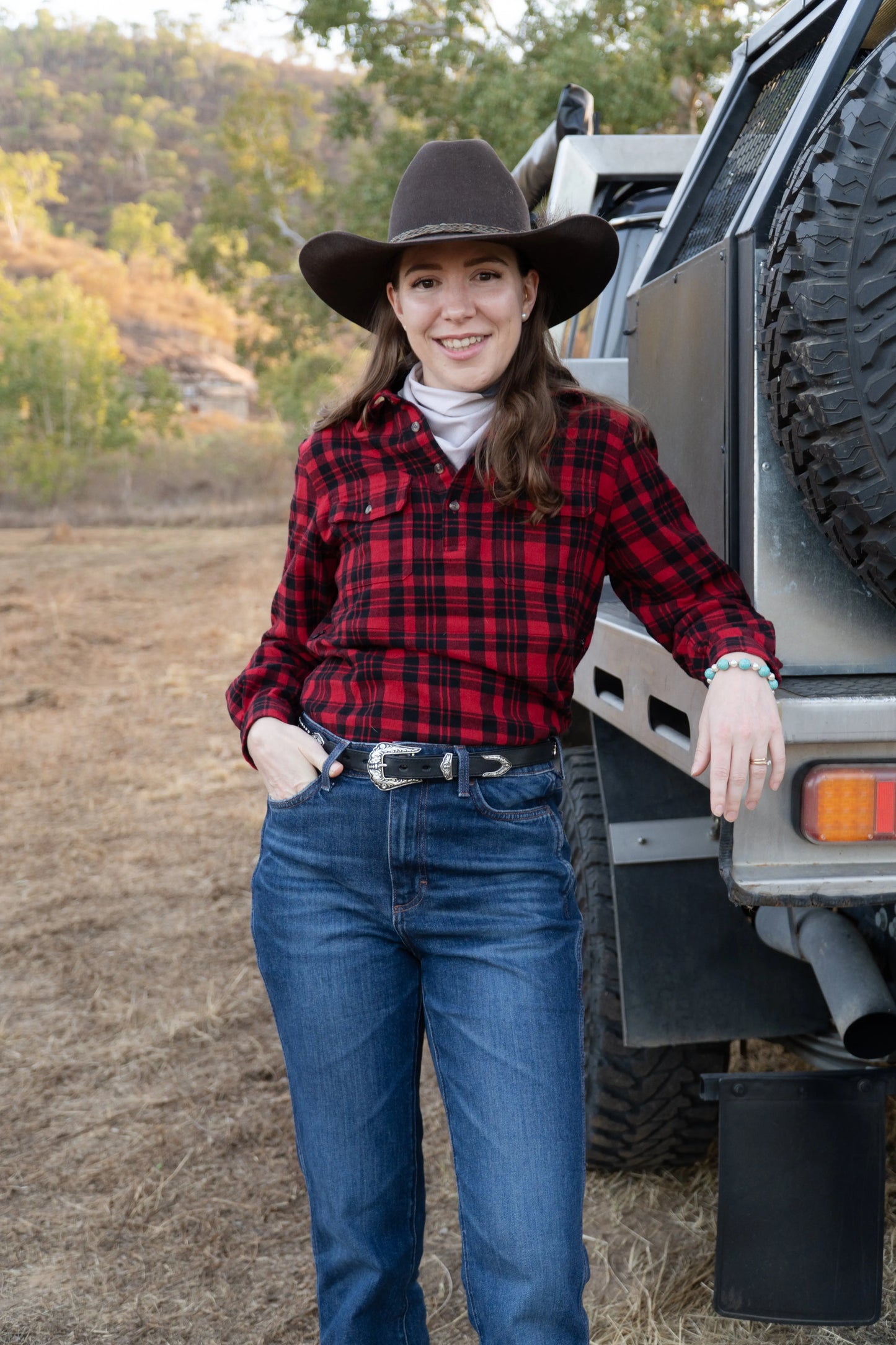 Standing next to ute in flanny breastfeeding shirt