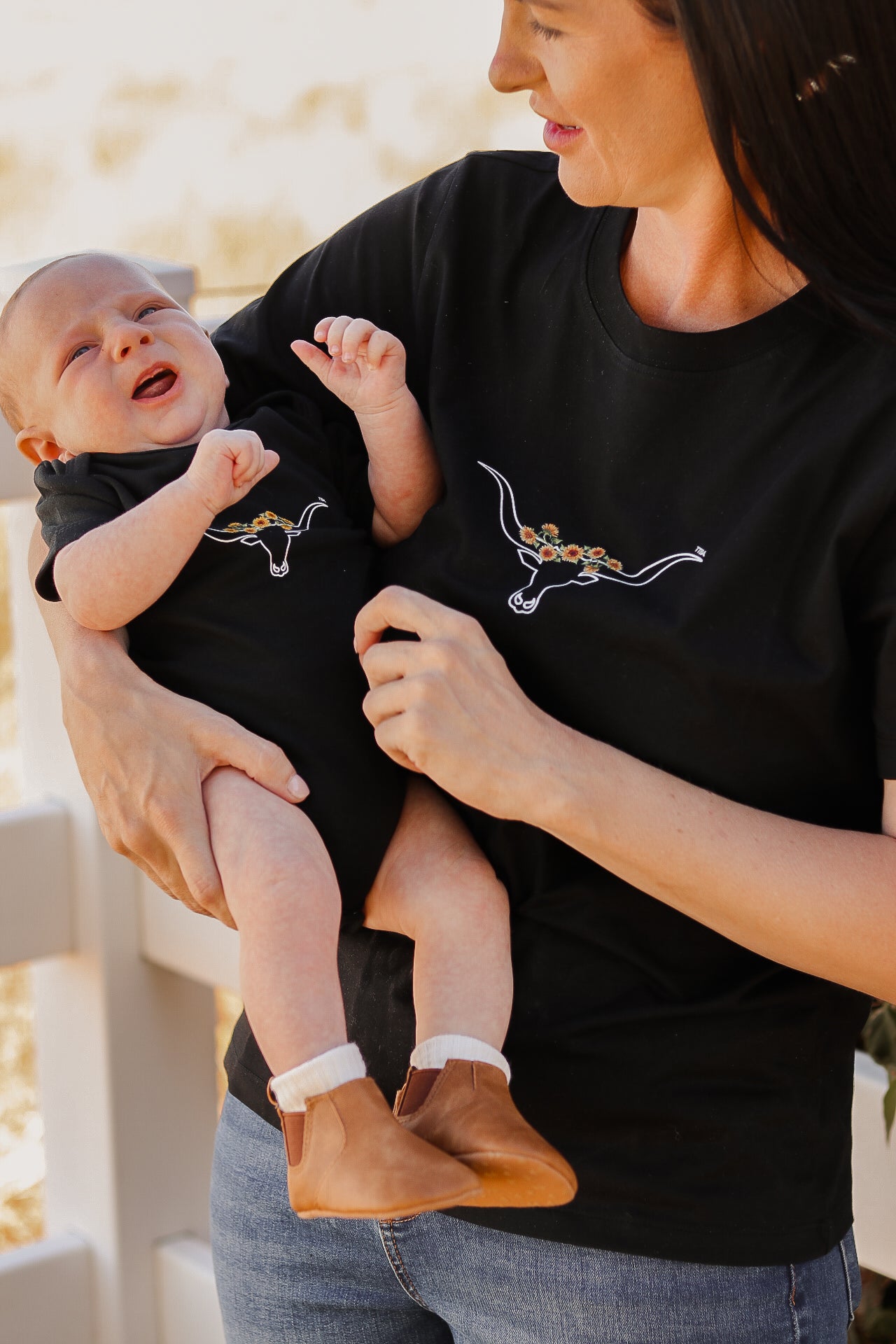 Mother and baby wearing matching sets, mum wearing a tittytees breastfeeding shirt. 
