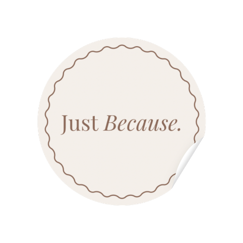Round white sticker with 'Just Because' text on a white background