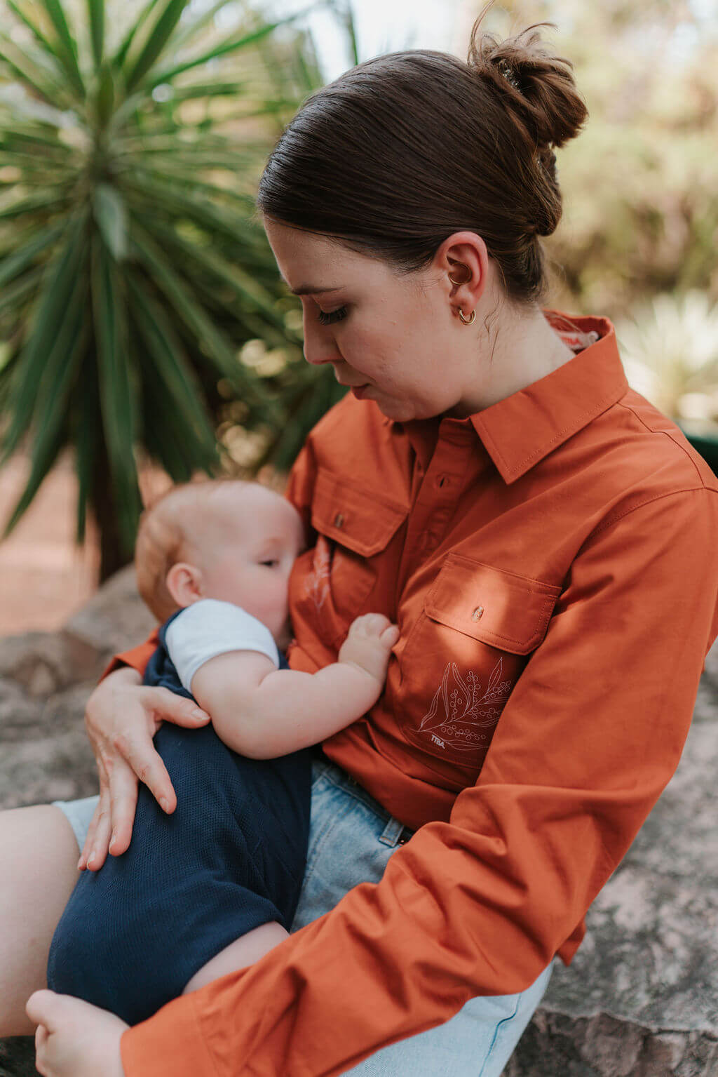 Mum looking at baby while breastfeeding 
