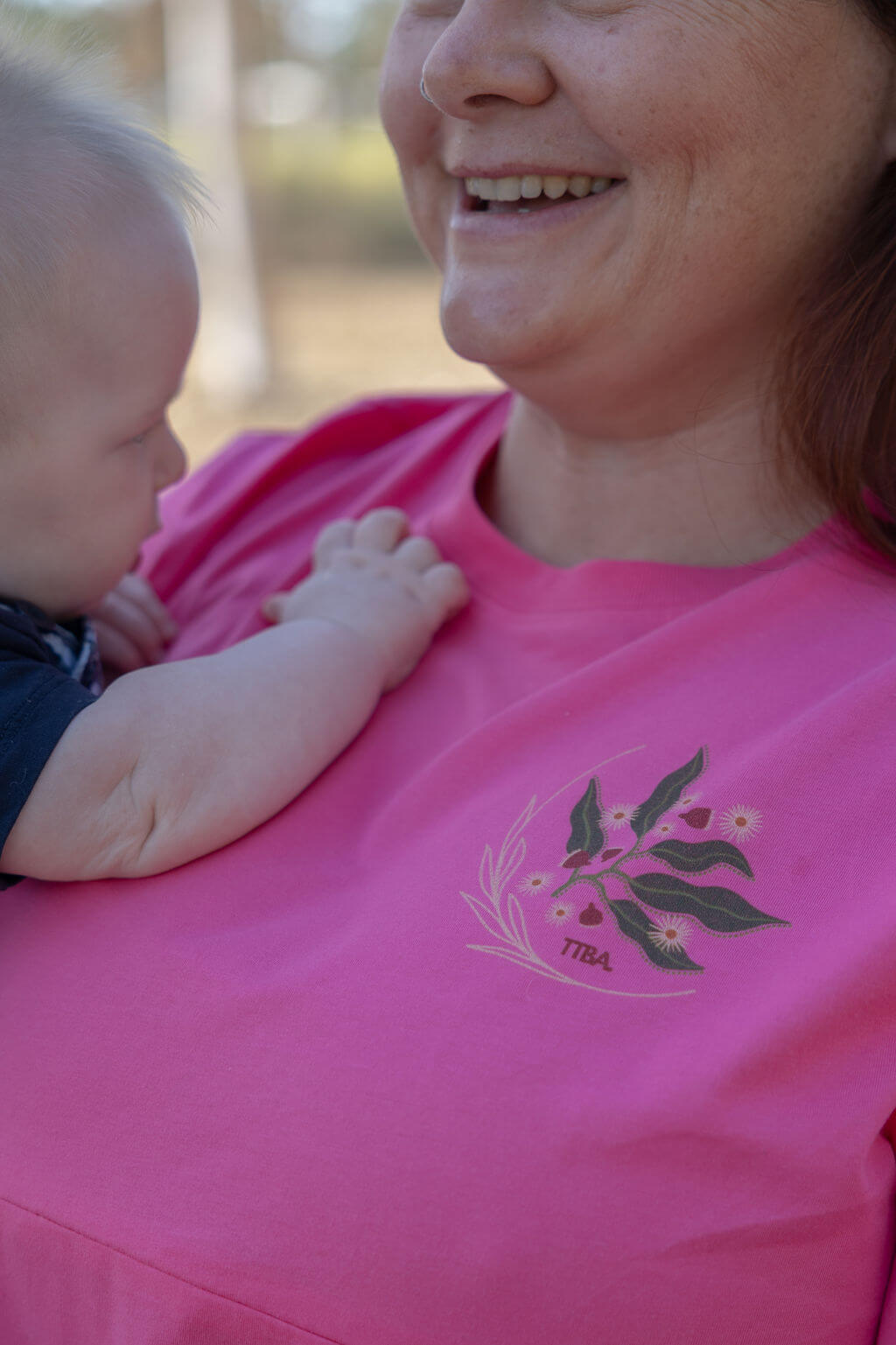 Close up of TittyTees pin breastfeeding shirt artwork in 