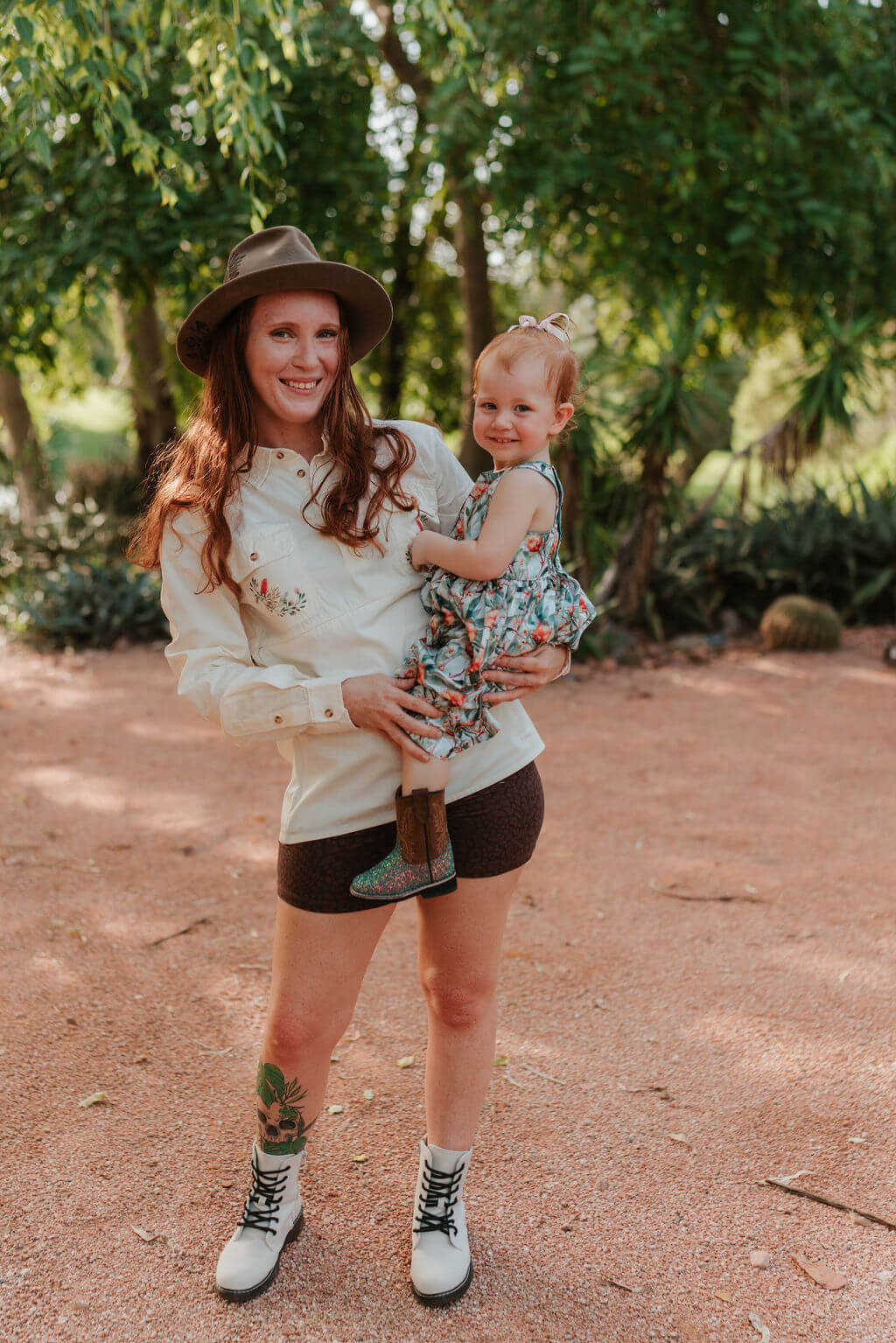 Mum holding baby outdoors 