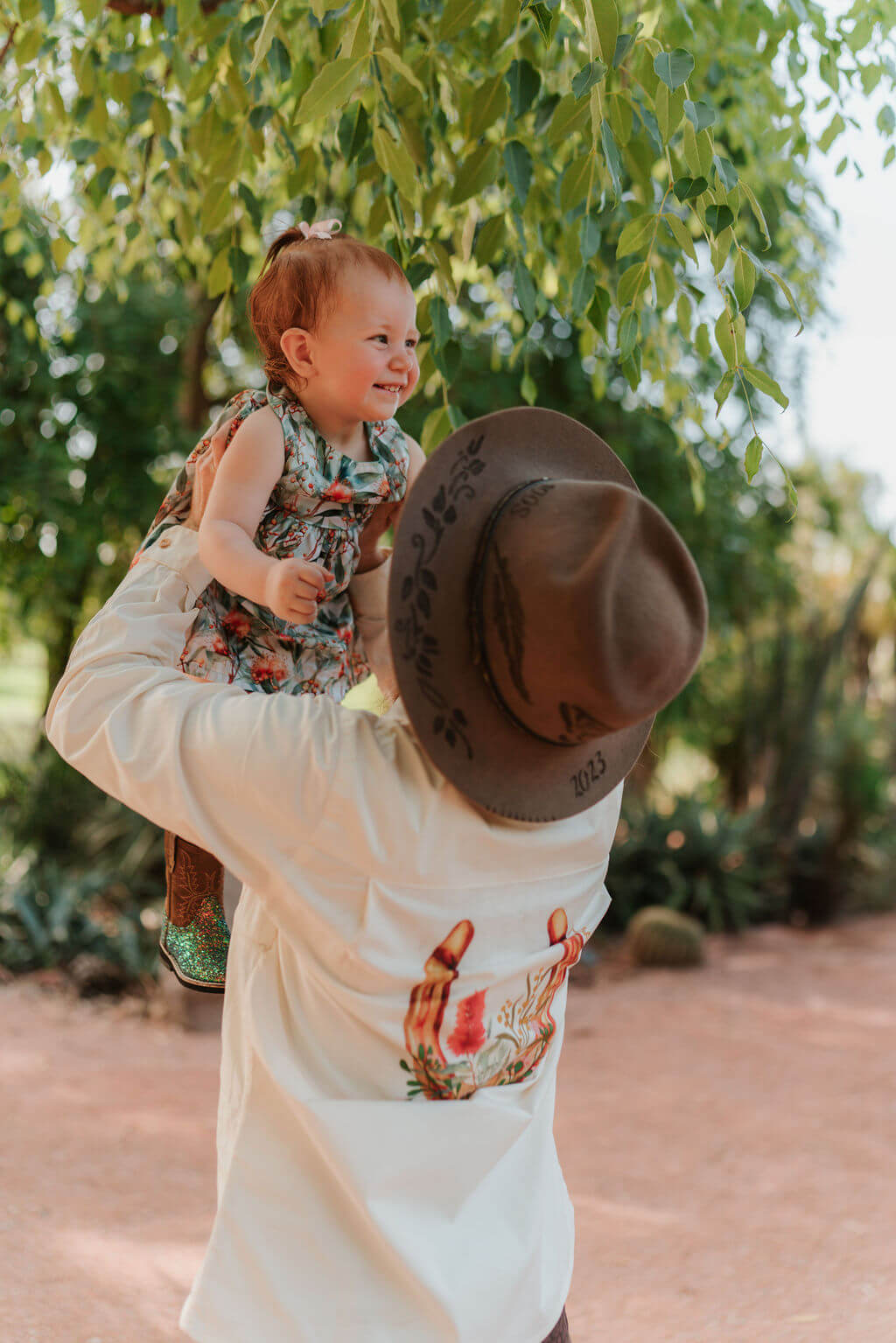 Mum holding baby up in the air 
