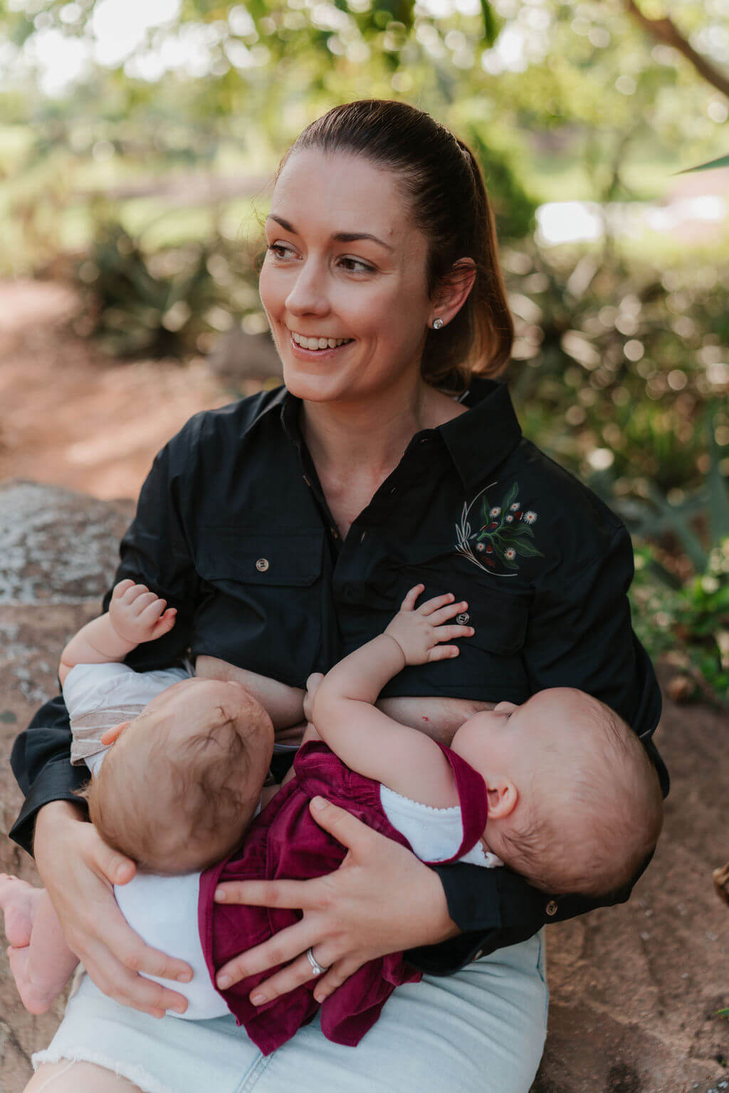 Mum breastfeeding twins wearing long sleeve breastfeeding shirt 