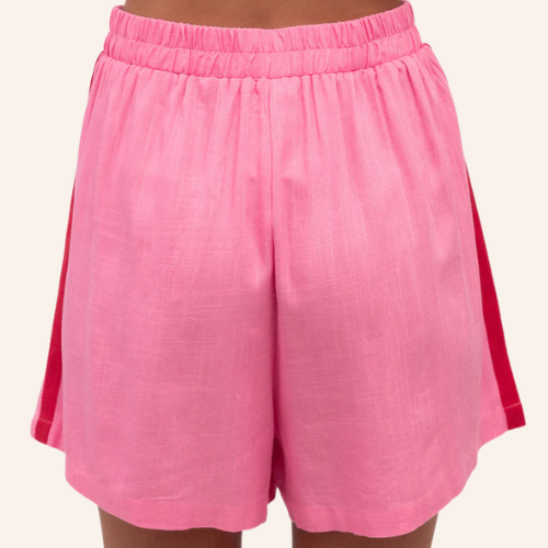 Pink maternity and postpartum shorts with a red side stripe on a white background