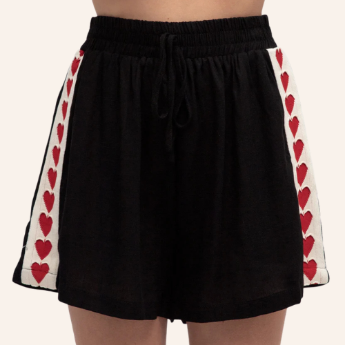 Black maternity shorts with red heart designs on white stripes